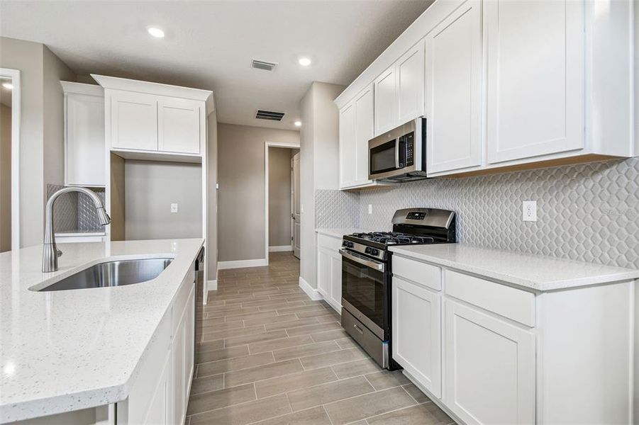 Furnished interior view inside a new home in Fairway Pointe - 55+ Villa Community, Sun City Center (Image 4).