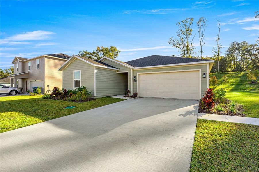 Front exterior of a new home in Tara Forest East, Alachua, FL, highlighting curb appeal (Image 21).