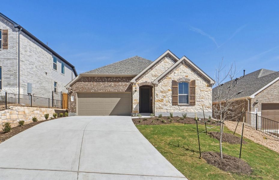 Front exterior of a new home in West Cypress Hills, Spicewood, TX, highlighting curb appeal (Image 1). Front exterior of a new home in West Cypress Hills, Spicewood, TX, highlighting curb appeal (Image 1).
