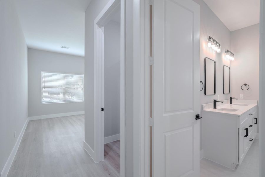Primary bedroom's ensuite design adds convenience and privacy