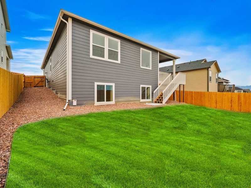 Exterior details and patio area of a home in Ridge at Lorson Ranch, Colorado Springs (Image 24).