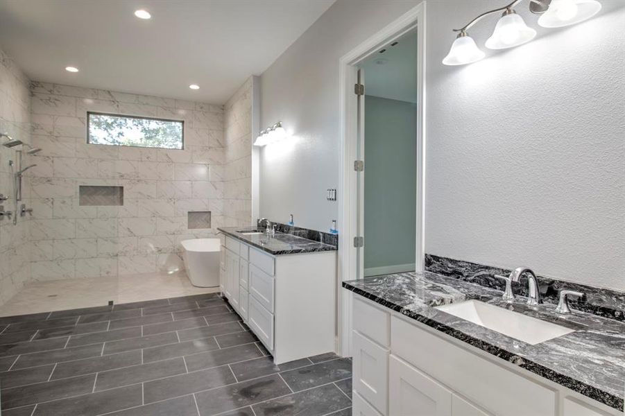 Bathroom featuring vanity, independent shower and bath, and tile patterned floors