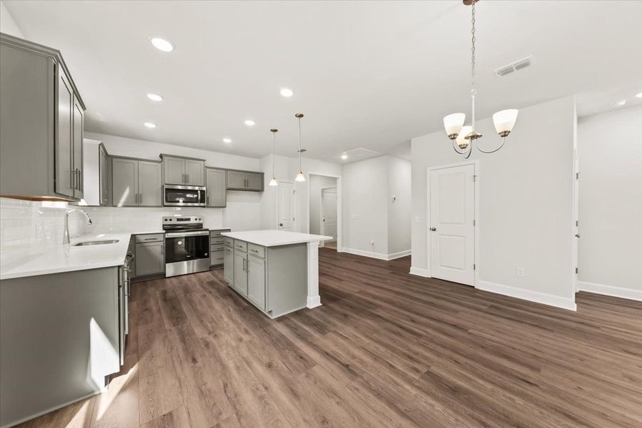 Kitchen with grey cabinetry Kitchen with grey cabinetry