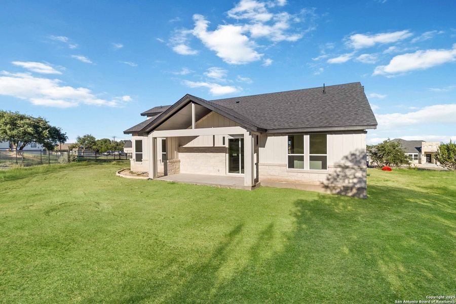 Front exterior of a new home in , Blanco, TX, highlighting curb appeal (Image 2).