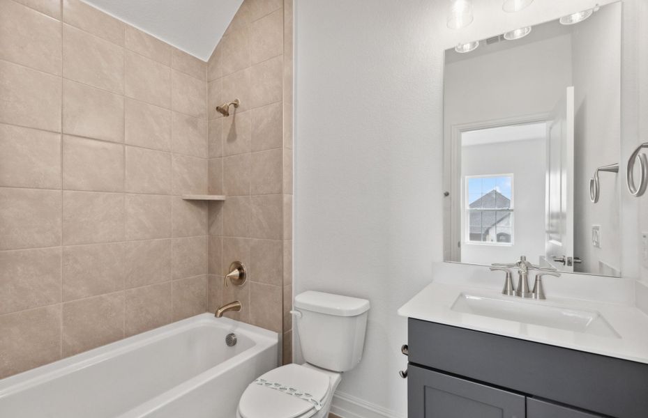 Spacious secondary bathroom with premium upgrades *real home pictured