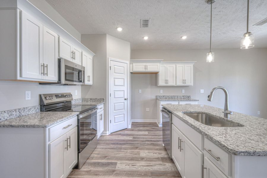 Furnished interior view inside a new home in Fox Run, Manchester (Image 5).