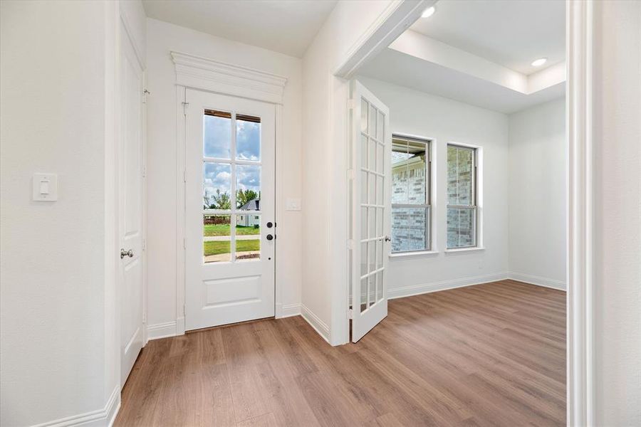 Entryway with light hardwood / wood-style flooring