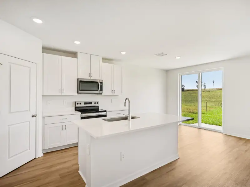 Furnished interior view inside a new home in The Grove at Stuart Crossing - Classic Series, Bartow (Image 4). Furnished interior view inside a new home in The Grove at Stuart Crossing - Classic Series, Bartow (Image 4).