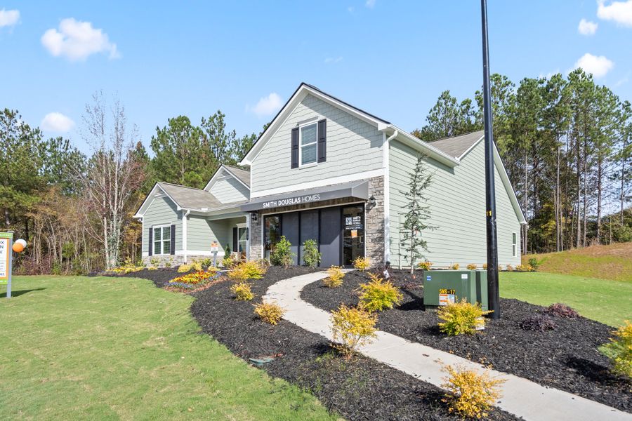 Front exterior of a new home in Maddox Station, Eatonton, GA, highlighting curb appeal (Image 2). Front exterior of a new home in Maddox Station, Eatonton, GA, highlighting curb appeal (Image 2).