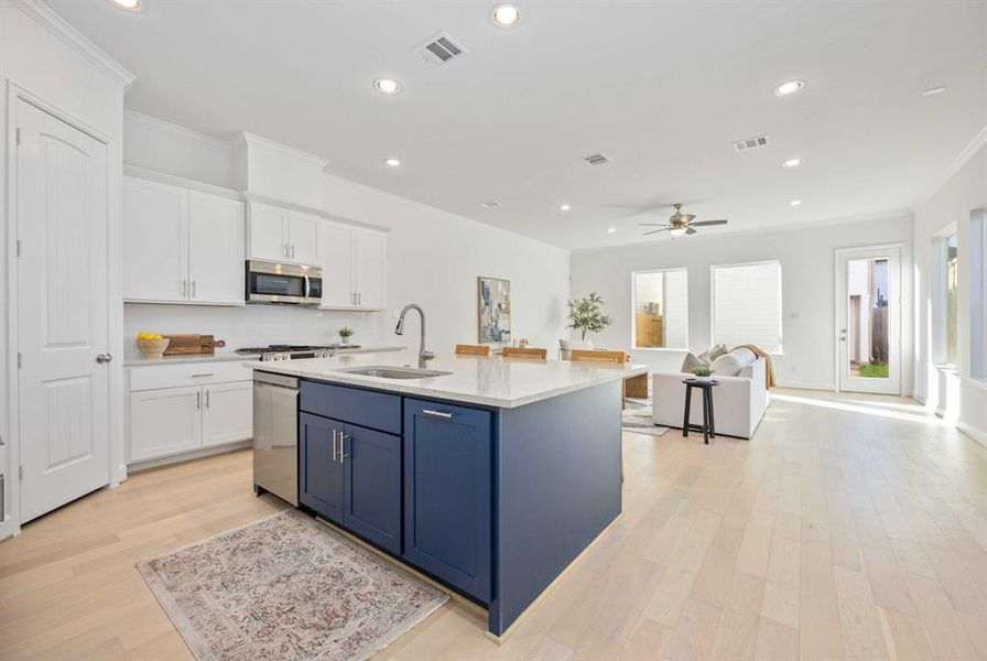 Imagine cooking gourmet meals in this chef’s kitchen, featuring a large island that opens to the den with scenic backyard views.