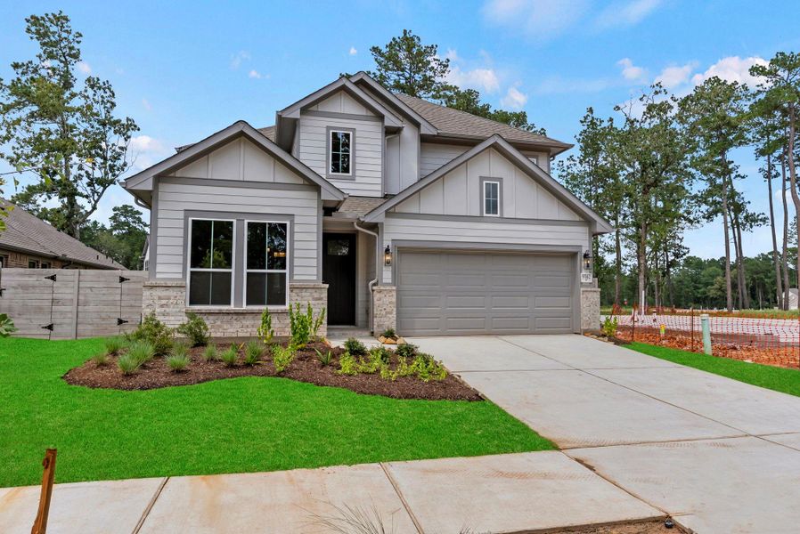 Front exterior of a new home in Two Step Farm, Montgomery, TX, highlighting curb appeal (Image 2). Front exterior of a new home in Two Step Farm, Montgomery, TX, highlighting curb appeal (Image 2).