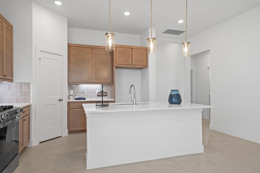 Furnished interior view inside a new home in Sunterra, Katy (Image 14).