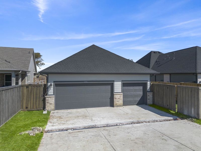 Front exterior of a new home in Riceland, Mont Belvieu, TX, highlighting curb appeal (Image 29). Front exterior of a new home in Riceland, Mont Belvieu, TX, highlighting curb appeal (Image 29).