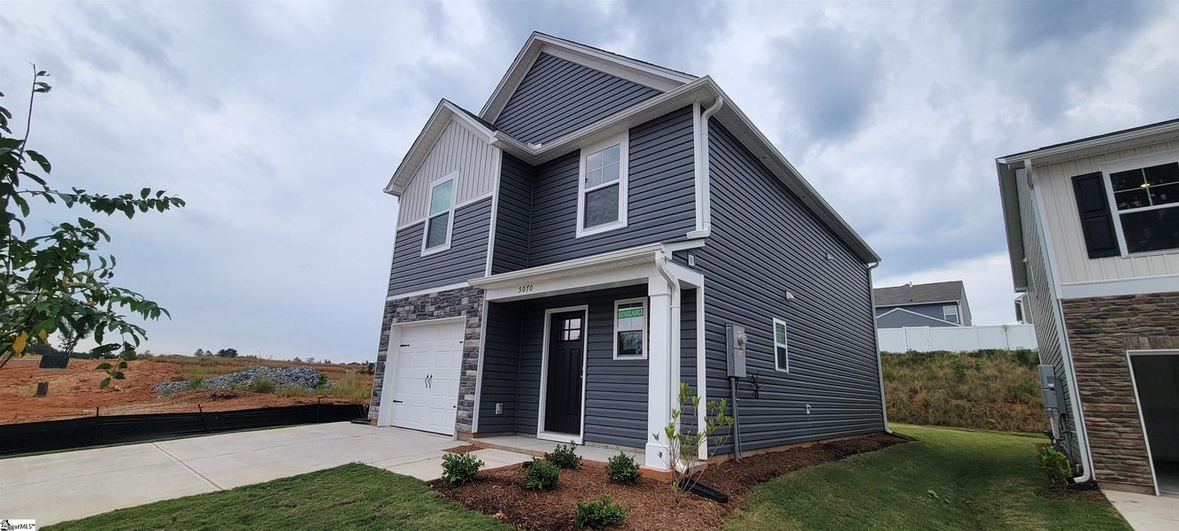Front exterior of a new home in Hazelwood, Boiling Springs, SC, highlighting curb appeal (Image 16). Front exterior of a new home in Hazelwood, Boiling Springs, SC, highlighting curb appeal (Image 16).