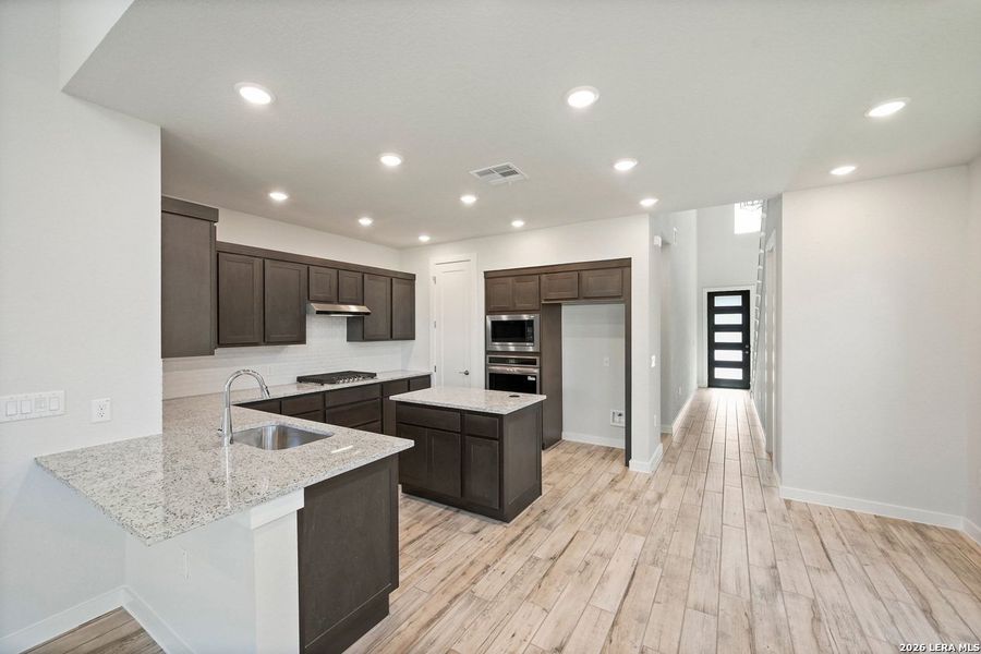 Furnished interior view inside a new home in VIDA, San Antonio (Image 6).