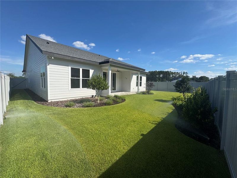 Exterior details and patio area of a home in Laureate Village, Newberry (Image 25).