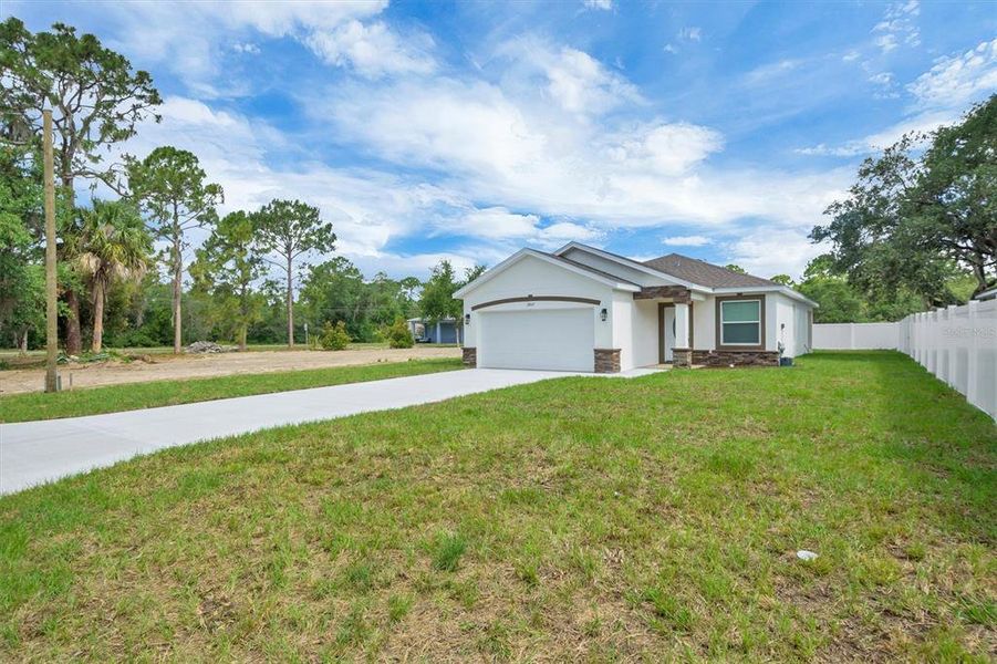 Front exterior of a new home in , Lake Wales, FL, highlighting curb appeal (Image 19). Front exterior of a new home in , Lake Wales, FL, highlighting curb appeal (Image 19).
