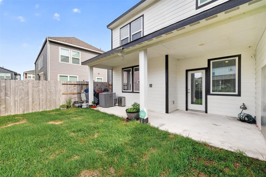 Exterior details and patio area of a home in McClendon Park Village, Houston (Image 27).