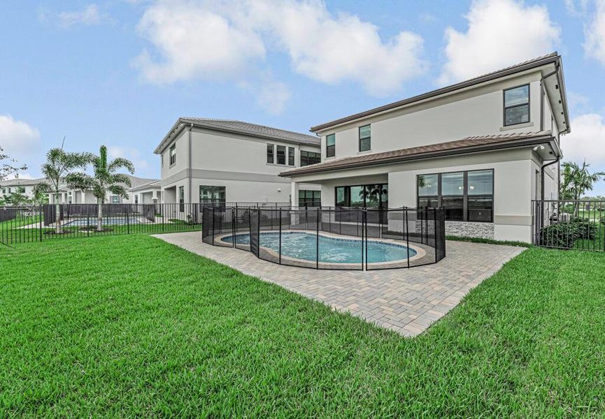 Exterior details and patio area of a home in Apex at Avenir, Palm Beach Gardens (Image 35).