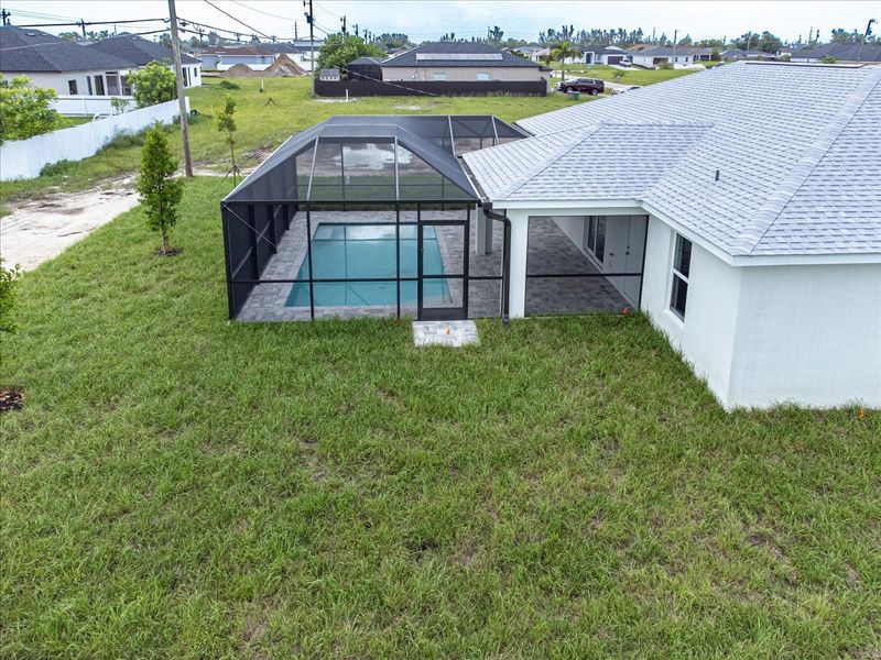 Representative exterior photo of a completed home built from the The Tidewater by Sunlife Homes LLC in Cape Coral, Cape Coral, FL (Image 2). Representative exterior photo of a completed home built from the The Tidewater by Sunlife Homes LLC in Cape Coral, Cape Coral, FL (Image 2).