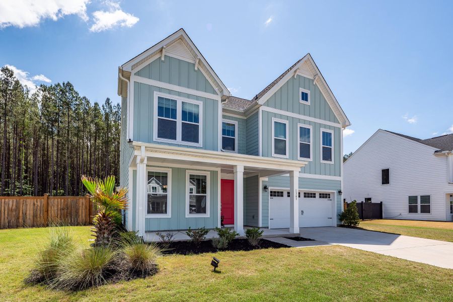Front exterior of a new home in , Ravenel, SC, highlighting curb appeal (Image 2). Front exterior of a new home in , Ravenel, SC, highlighting curb appeal (Image 2).