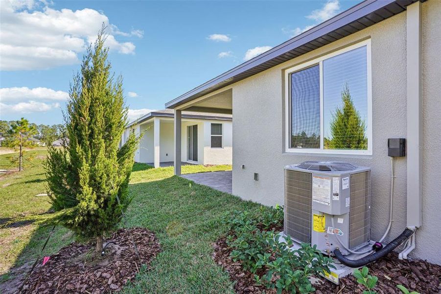 Exterior details and patio area of a home in Ridgehaven - Villas, Ormond Beach (Image 23).