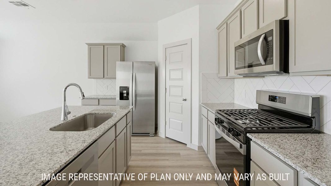 Furnished interior view inside a new home in Reserve at Mallard Lakes, Orange (Image 4).