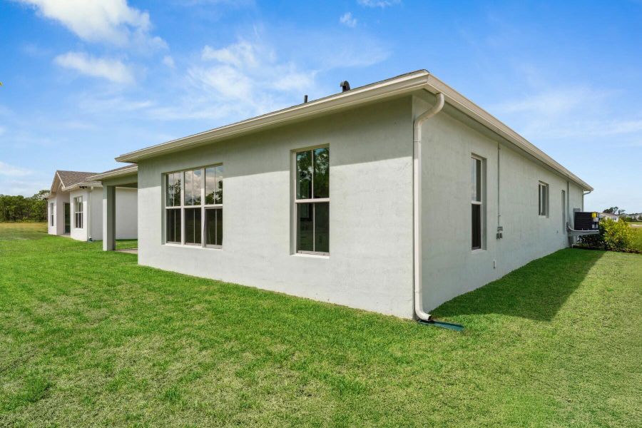 Front exterior of a new home in , Port St. Lucie, FL, highlighting curb appeal (Image 27). Front exterior of a new home in , Port St. Lucie, FL, highlighting curb appeal (Image 27).