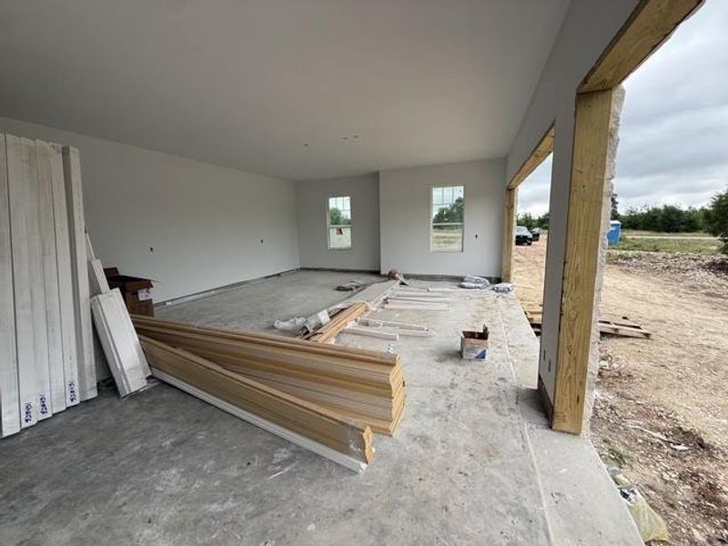 A spacious, newly constructed garage offers ample storage with views of the surrounding natural landscape.