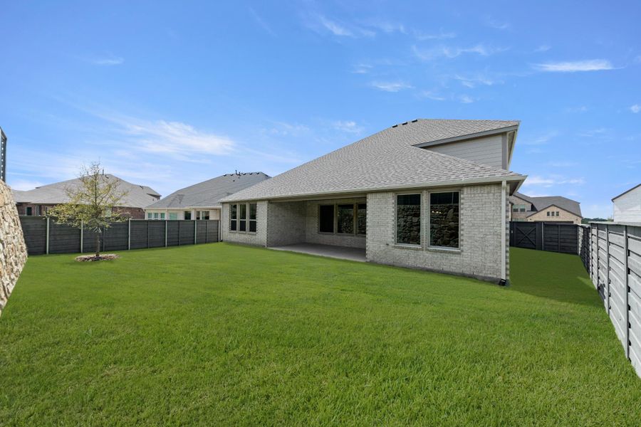 Exterior details and patio area of a home in Union Park, Little Elm (Image 3).