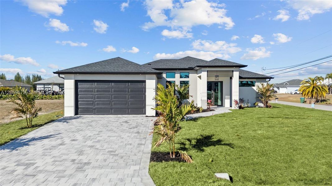 Front exterior of a new home in , Cape Coral, FL, highlighting curb appeal (Image 26).