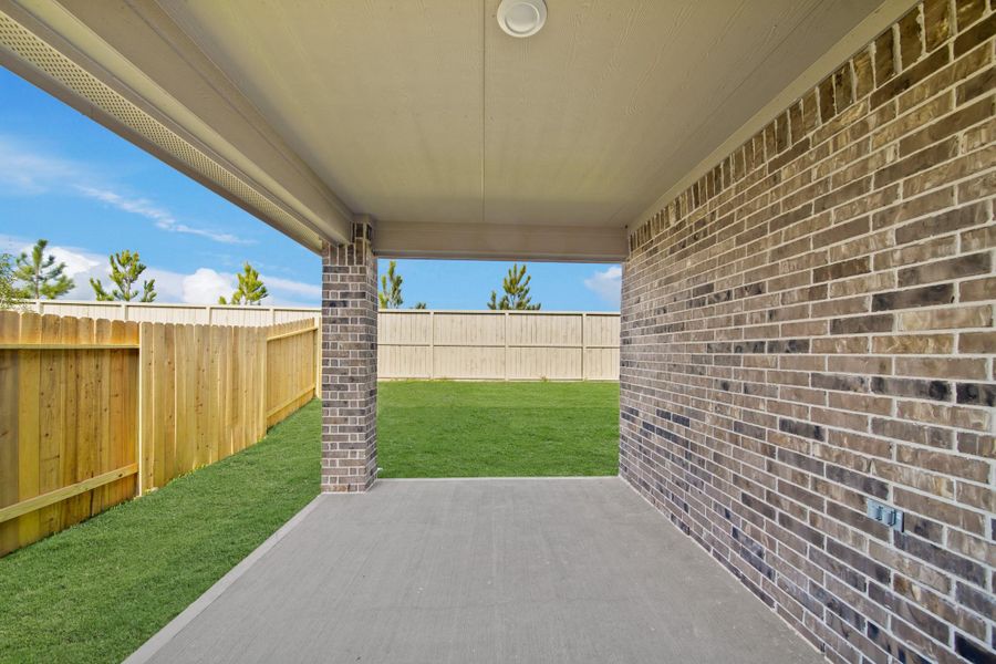Exterior details and patio area of a home in Harrington Trails at The Canopies, Splendora (Image 3).