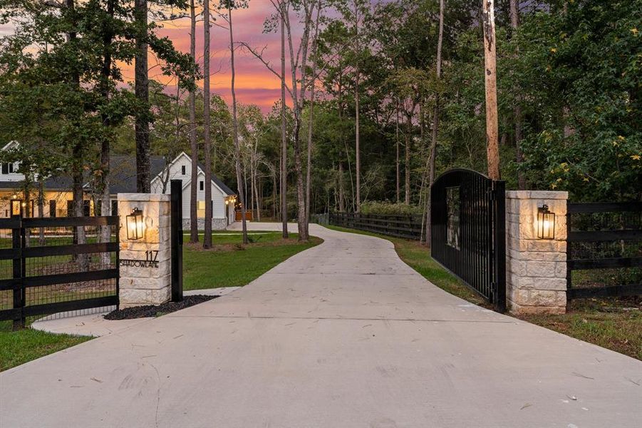 Fully fenced, this property also features an electronic entry gate which provides security to the homeowner and creates an amazing entrance to this home.