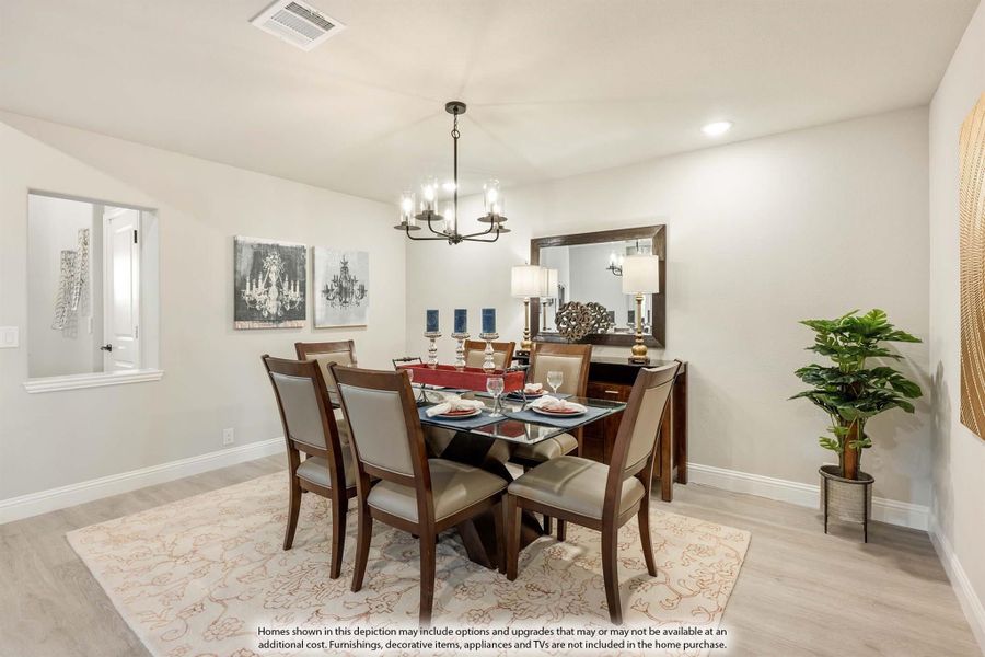 Dining room with glass-top table, six chairs, chandelier, and light hardwood floors Dining room with glass-top table, six chairs, chandelier, and light hardwood floors