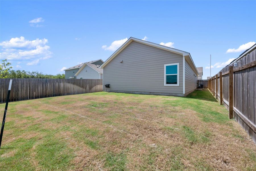 Back of property with a fenced backyard Back of property with a fenced backyard