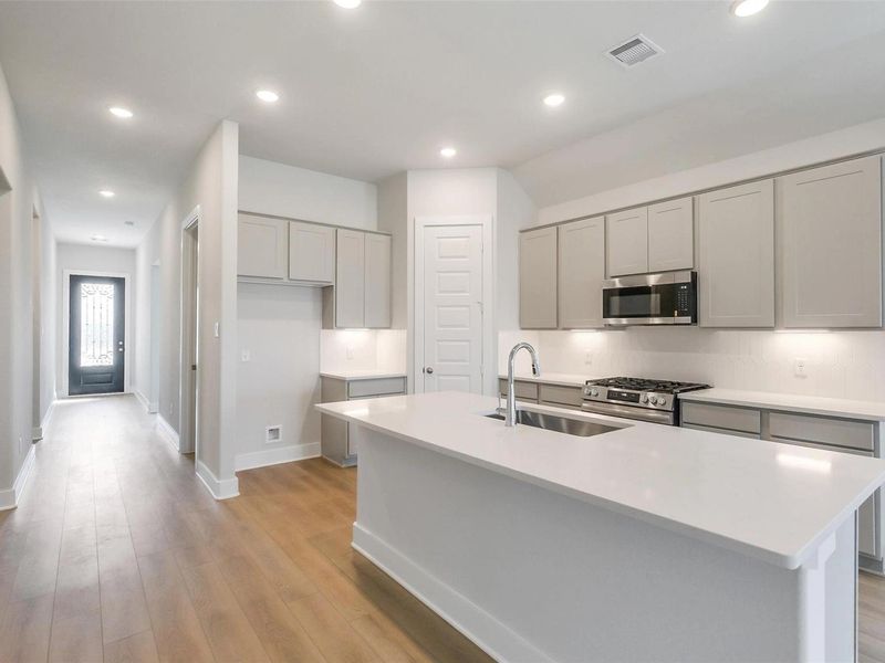 Furnished interior view inside a new home in Sunterra, Katy (Image 6).