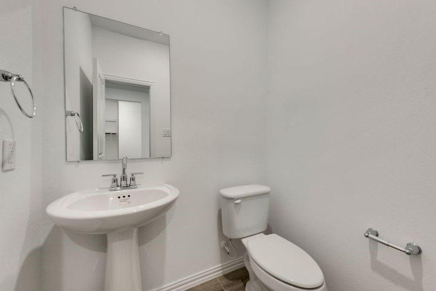 Bathroom with tile patterned flooring and toilet