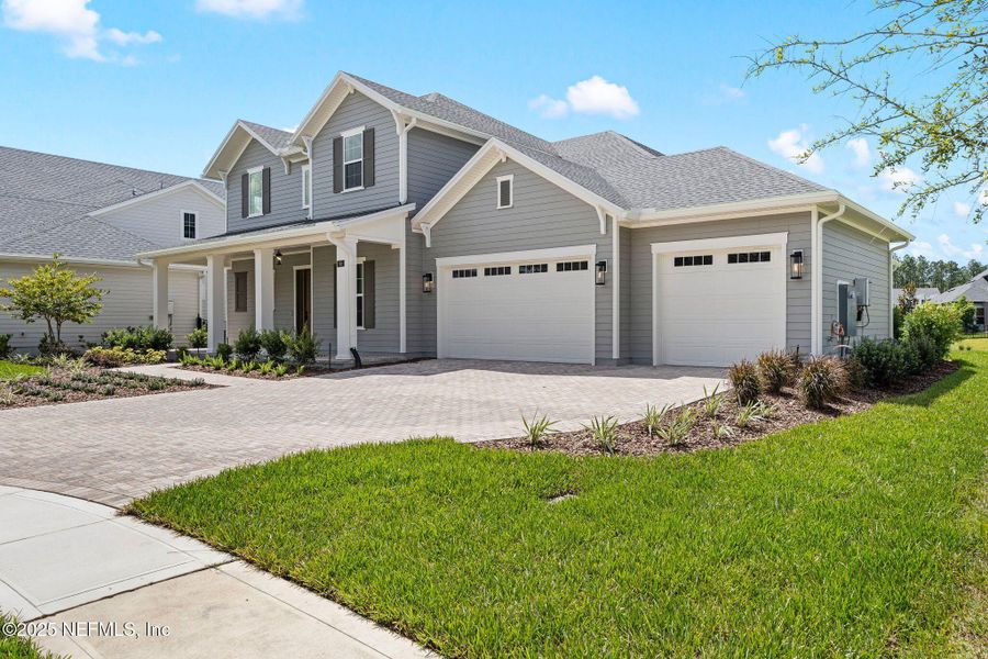 Front exterior of a new home in , St. Johns, FL, highlighting curb appeal (Image 18). Front exterior of a new home in , St. Johns, FL, highlighting curb appeal (Image 18).