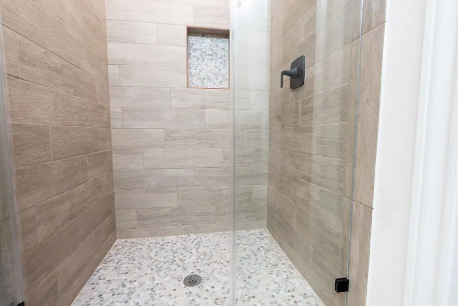 Bathroom featuring a stall shower Bathroom featuring a stall shower