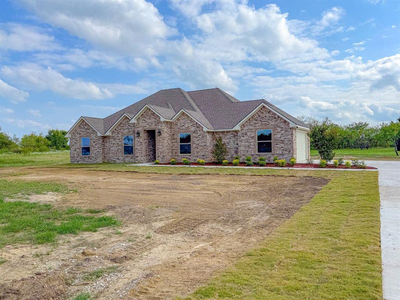 Front exterior of a new home in , Corsicana, TX, highlighting curb appeal (Image 2). Front exterior of a new home in , Corsicana, TX, highlighting curb appeal (Image 2).