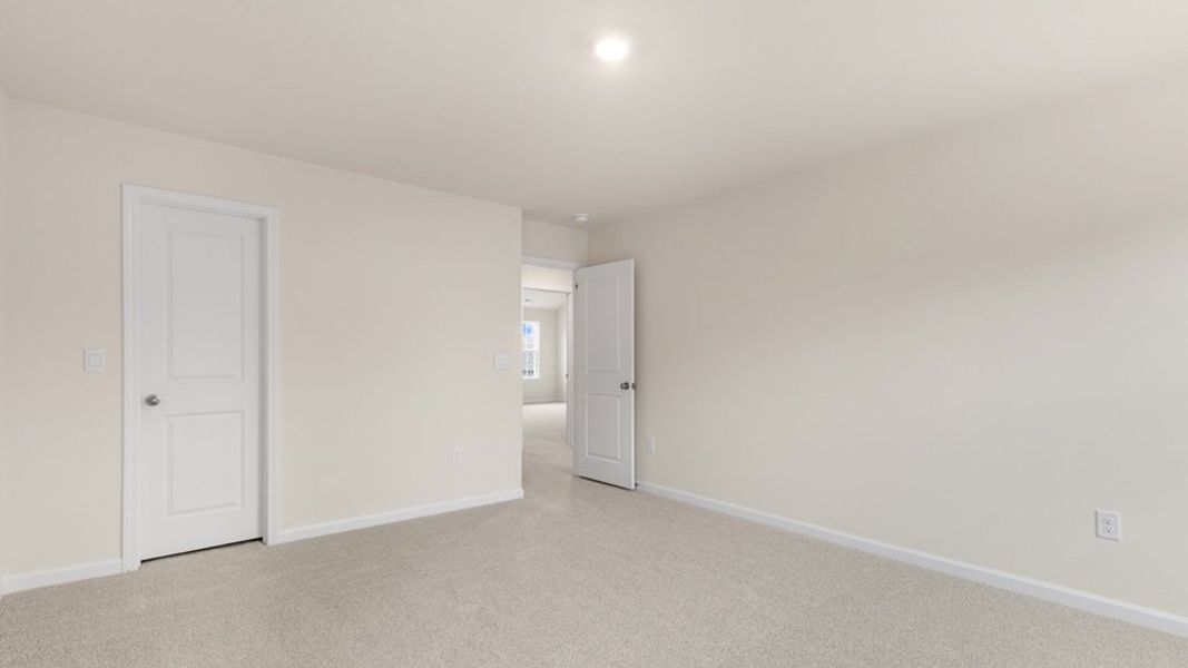 Spacious, unfurnished interior of a new home in The Estates at Edinborough, Gibsonville (Image 27).