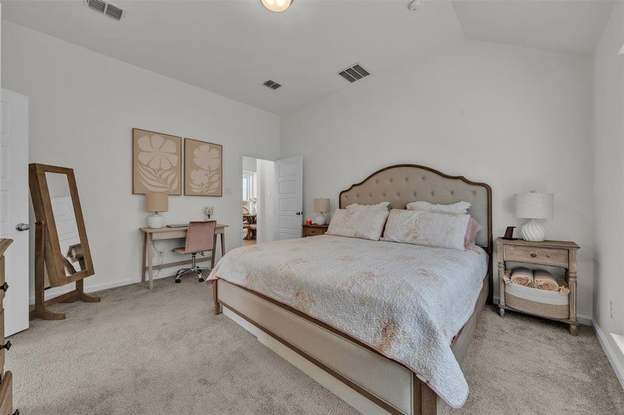 Carpeted room featuring a vaulted ceiling and recessed lighting Carpeted room featuring a vaulted ceiling and recessed lighting