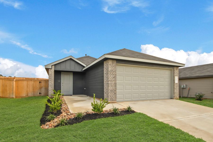 Front exterior of a new home in Mill Creek, Magnolia, TX, highlighting curb appeal (Image 2). Front exterior of a new home in Mill Creek, Magnolia, TX, highlighting curb appeal (Image 2).