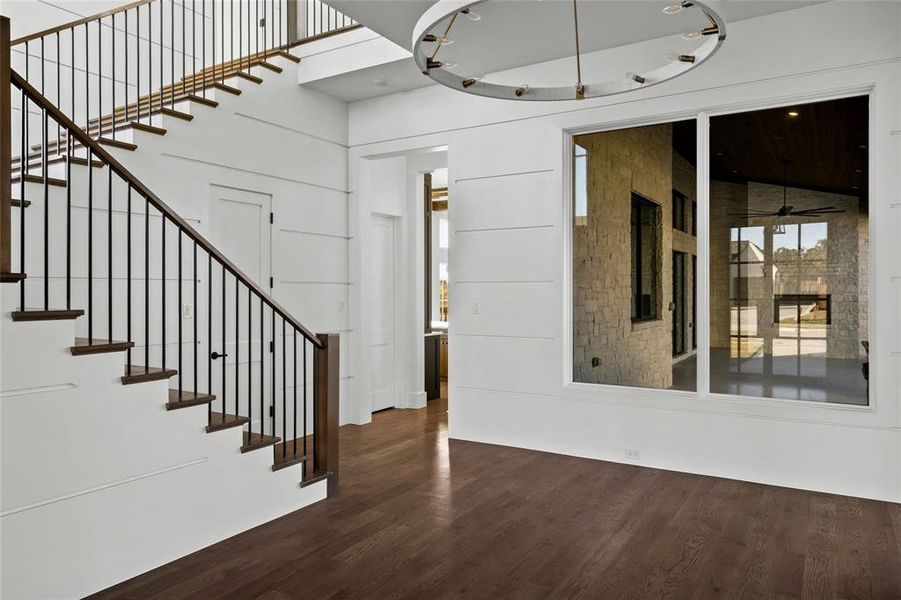 Foyer with dark wood-style floors and stairway Foyer with dark wood-style floors and stairway