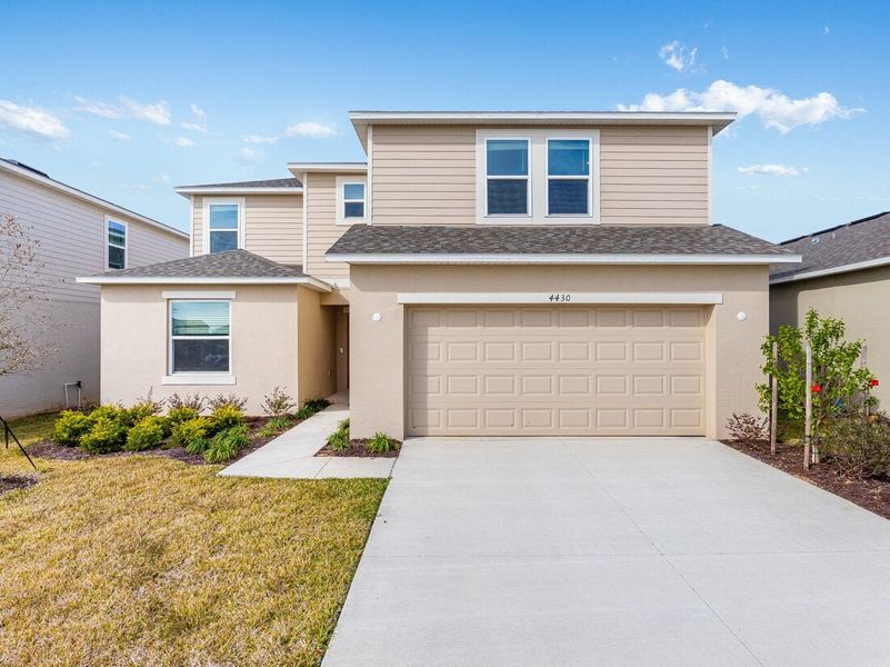 Representative exterior photo of a completed home built from the Redbud by Taylor Morrison in Scenic Terrace, Lake Hamilton, FL (Image 1).