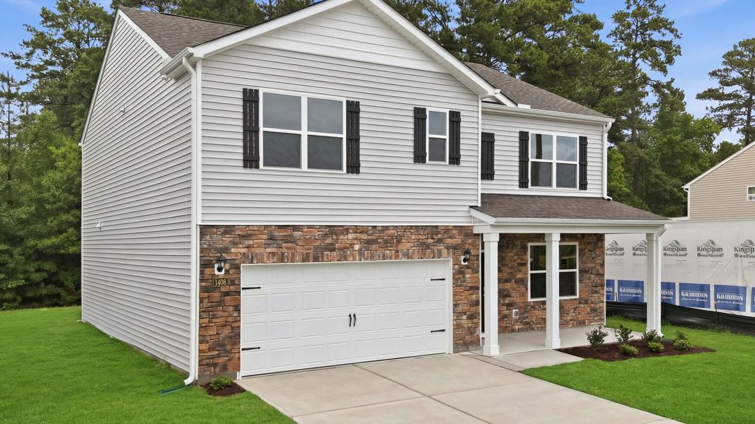 Front exterior of a new home in Ridgewood Farms, Winterville, NC, highlighting curb appeal (Image 21). Front exterior of a new home in Ridgewood Farms, Winterville, NC, highlighting curb appeal (Image 21).