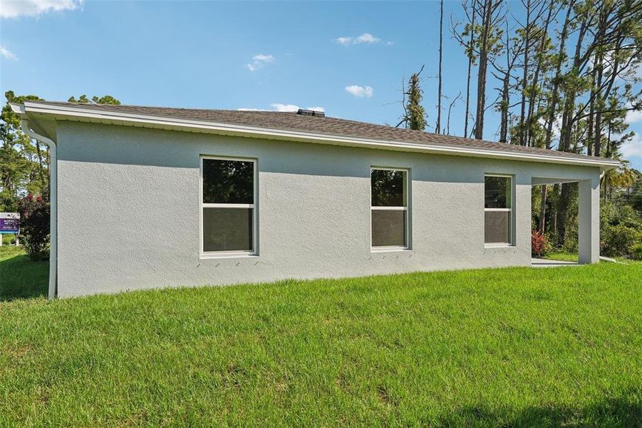 Exterior details and patio area of a home in North Port Classic, North Port (Image 31).