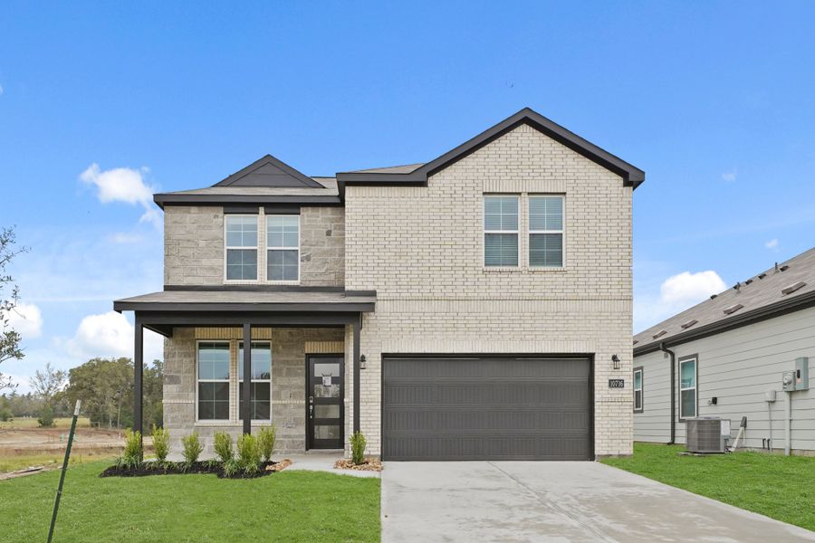 Front exterior of a new home in Reveille Estates, Bryan, TX, highlighting curb appeal (Image 1). Front exterior of a new home in Reveille Estates, Bryan, TX, highlighting curb appeal (Image 1).
