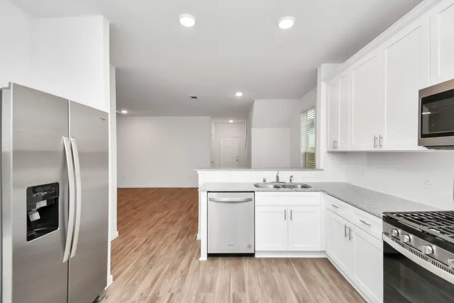Furnished interior view inside a new home in Decker Farms, Magnolia (Image 8).
