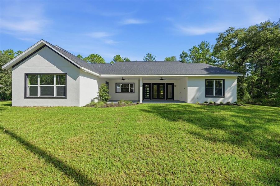 Exterior details and patio area of a home in , Wildwood (Image 33).